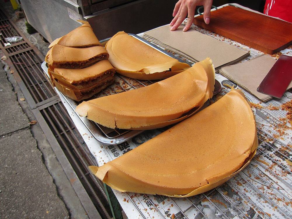 A large folded apam balik pancake, a Malaysian street snack