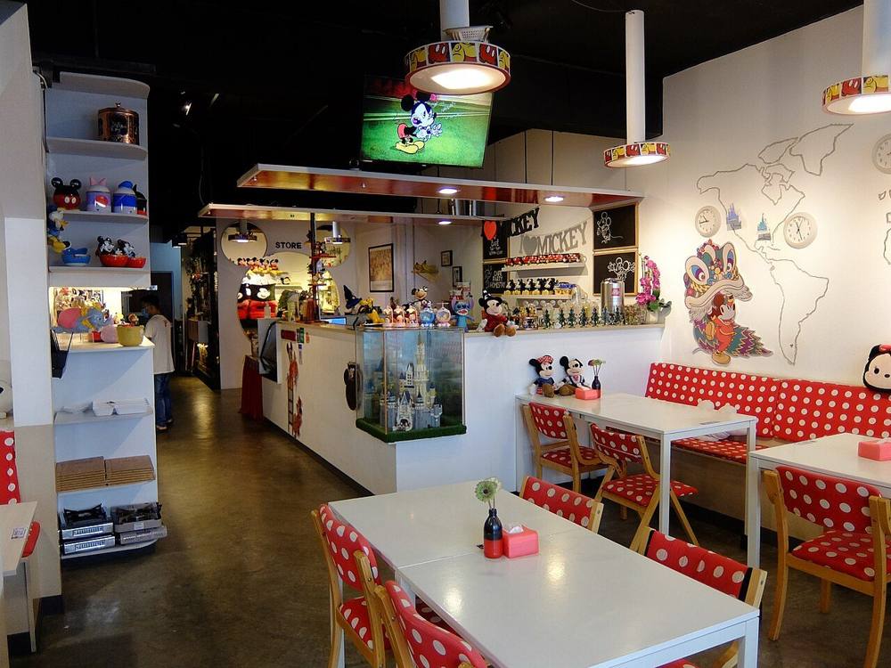 The interior of a cafe in Mount Austin, Johor Bahru, with tables and seating