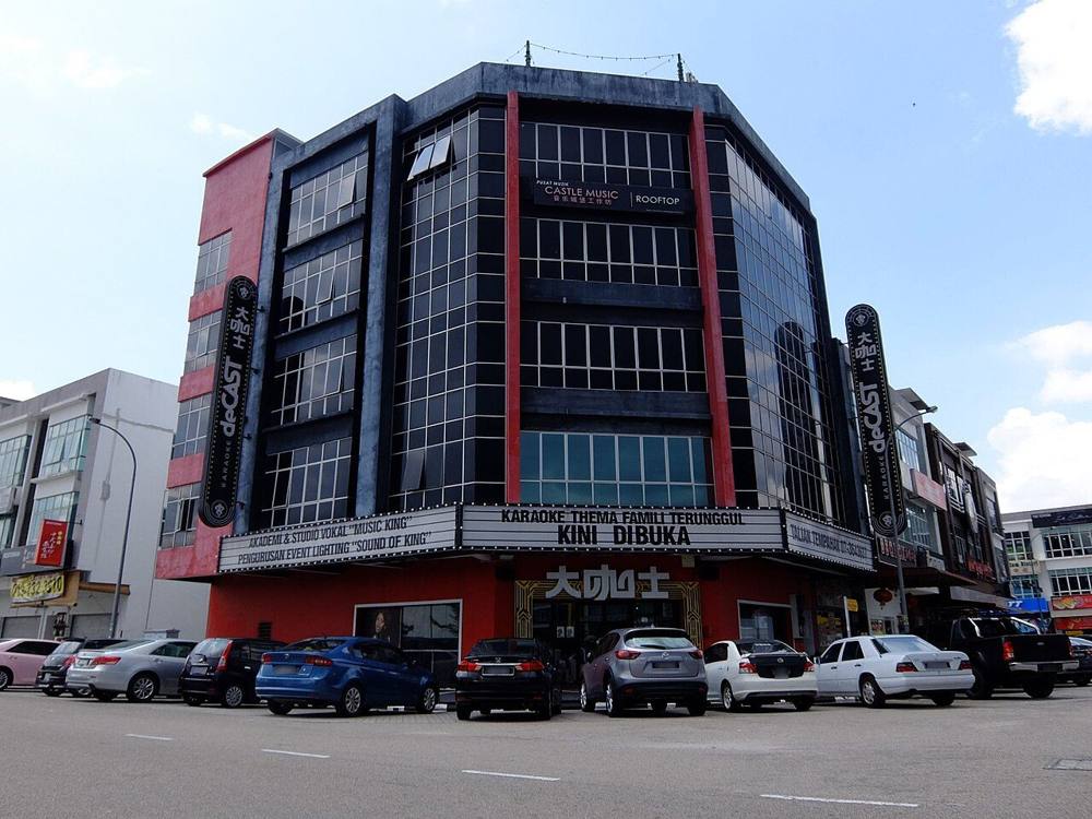 A corner-lot family karaoke building with car parking in Johor Bahru