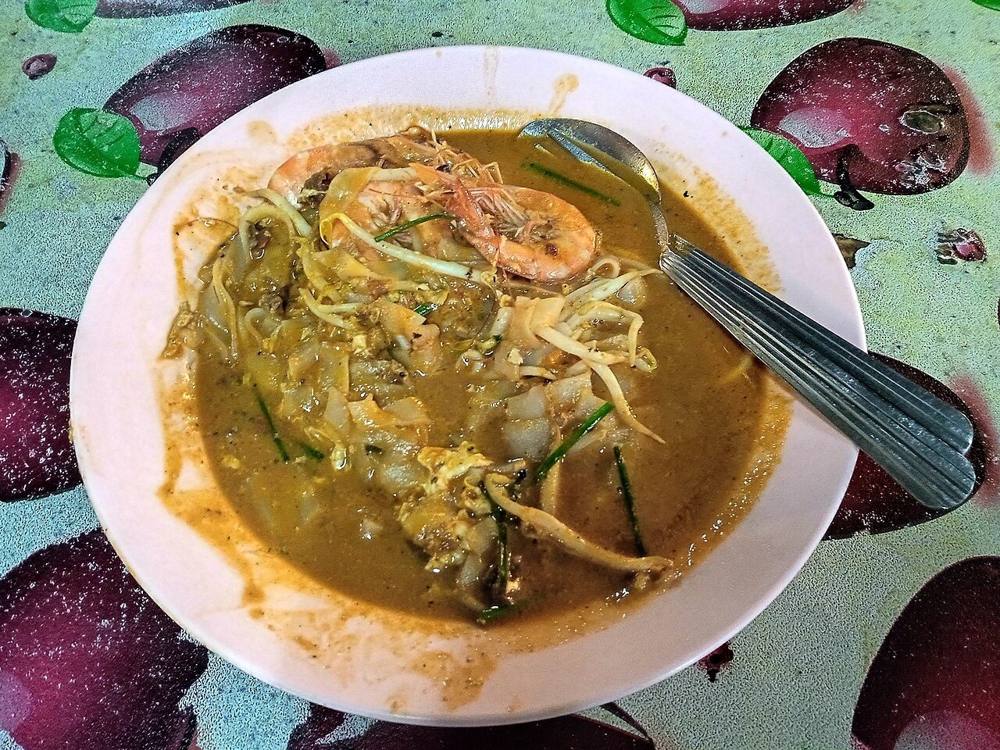 A plate of char kway teow, wok-fried flat rice noodles