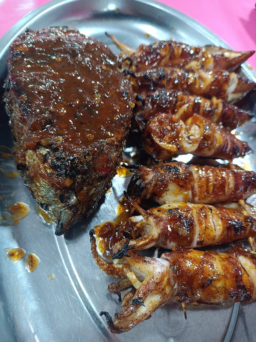 Grilled fish and squid at a night food market in Kota Kinabalu