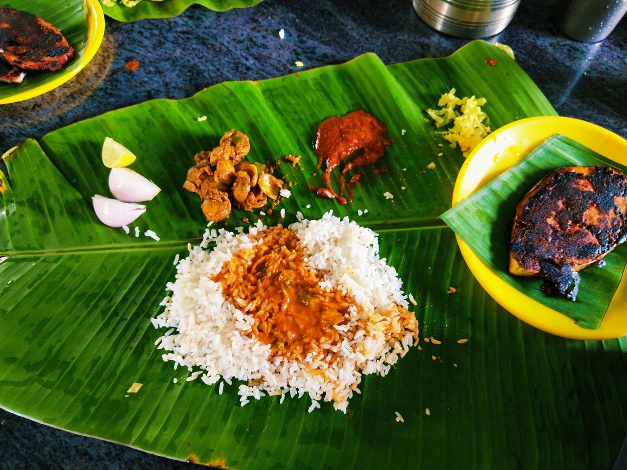 Banana leaf rice with fish curry and side dishes, Indian food near KSL