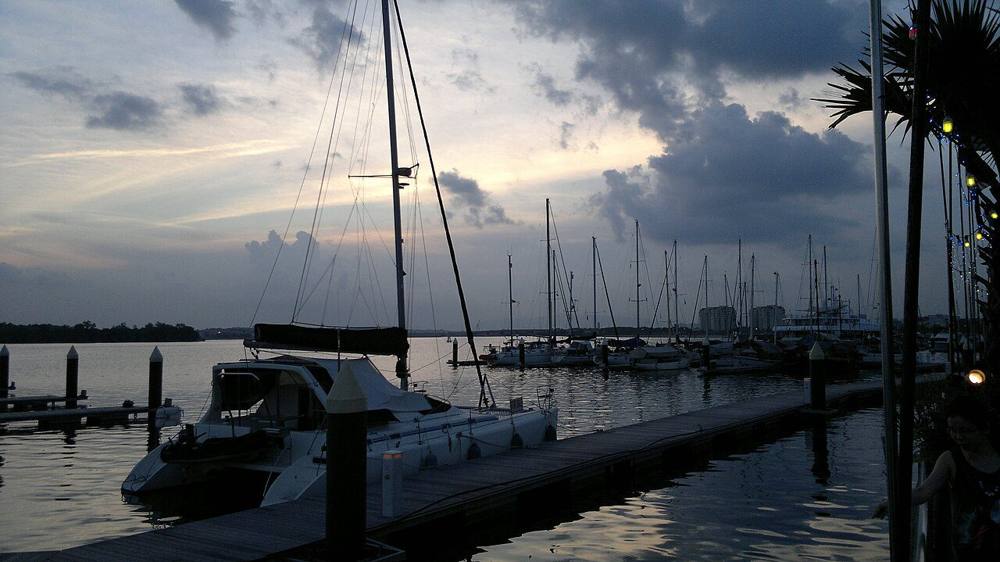 Yachts moored at the Danga Bay marina at dusk in Johor Bahru