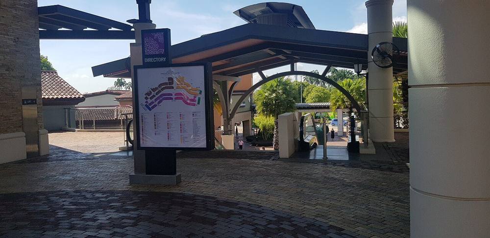 Covered walkway and directory map inside Johor Premium Outlets