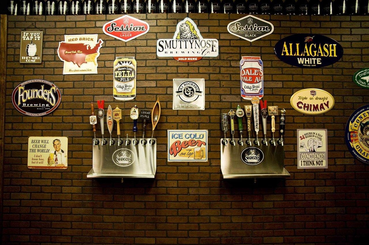 Craft beer taps lined up at a bar, pubs and bars near KSL