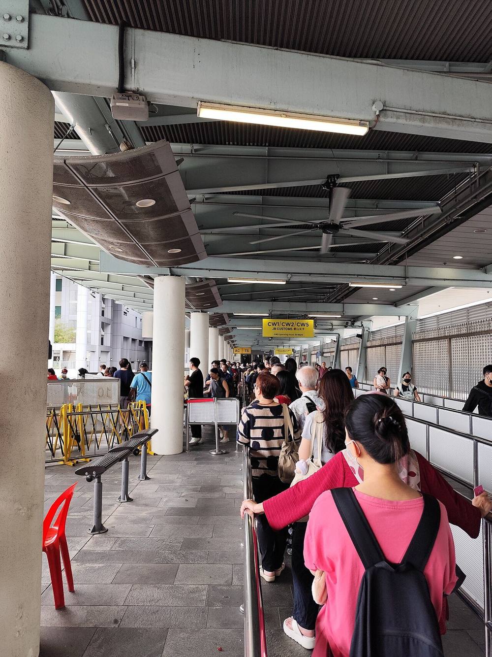 Queue at the Causeway Link boarding berth in the departure bus bay of Woodlands Checkpoint, November 2025